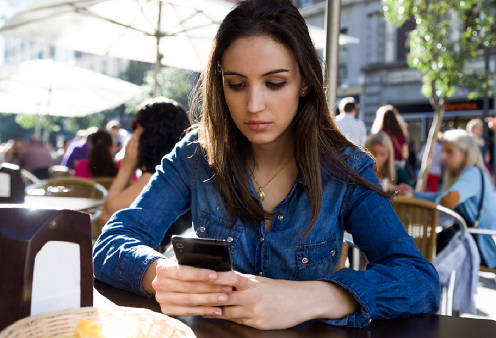 Blog 4 Beautiful Young Woman Using Her Mobile Phone In The Street
