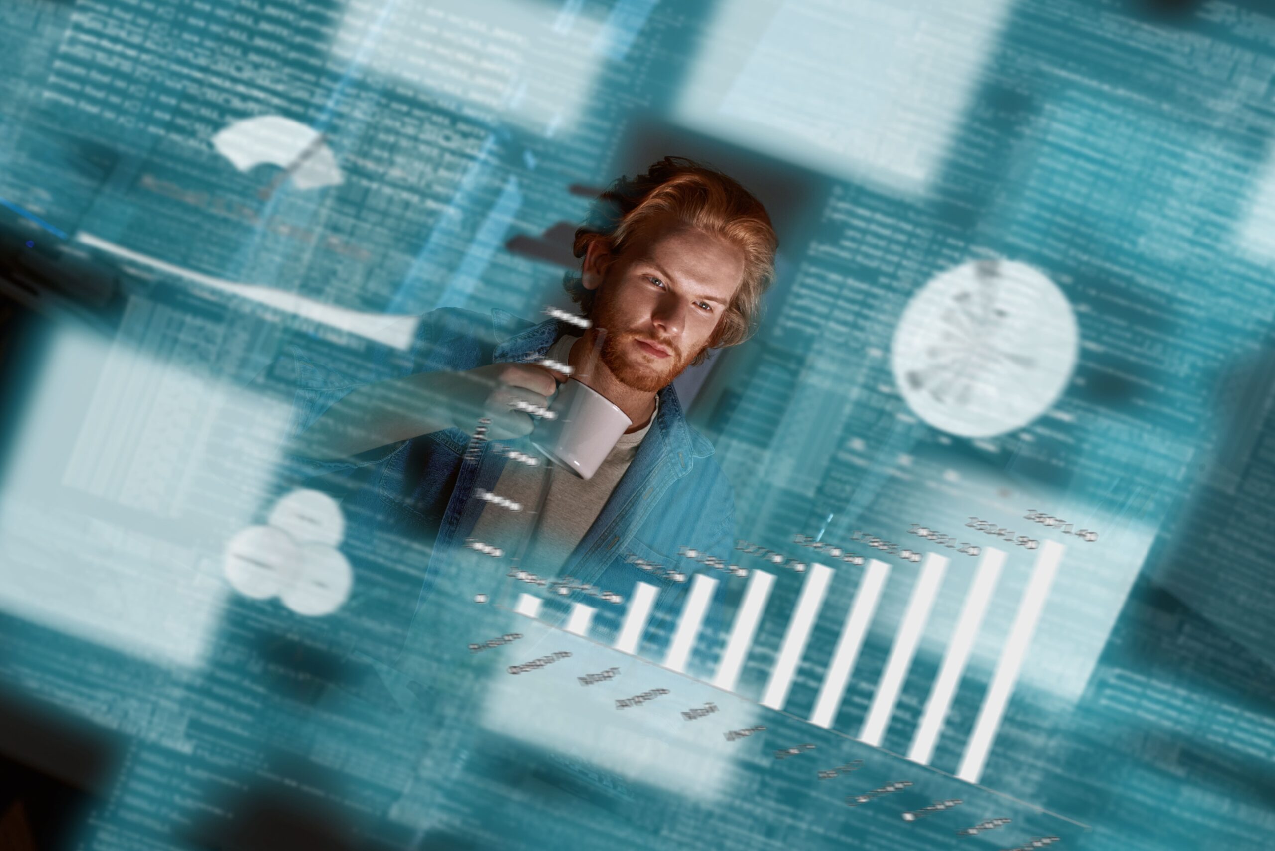 Blog 4 shot young red haired data analyst who works with big data he looks concentrated thougtful holding coffee crop big data developer business intelligence 1 scaled