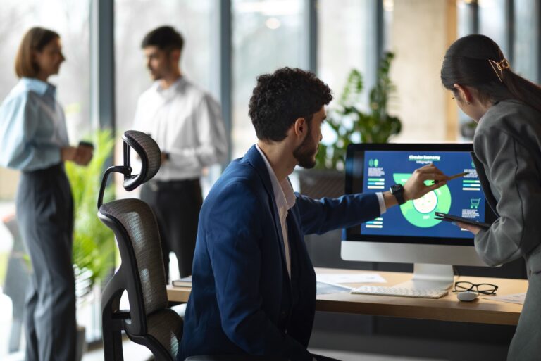 People in the office analyzing and reviewing financial charts 1